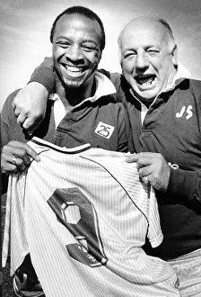 Sky Blues manager John Sillett hands the number 9 shirt to Cyrille Regis for tomorrow' Sky Blues manager John Sillett hands the number 9 shirt to Cyrille Regis for tomorrow'