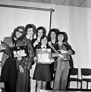 Images Dated 28th February 1975: Slade (l-r Noddy Holder, Jim Lea, Don Powell and Dave Hill) pictured with prize winners