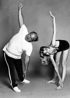 Images Dated 21st July 1977: Slimming - Exercises: Reaching for fitness: Roy Kinnear