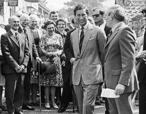 A smiling Prince Charles talks to villagers as he walks around the streets of Great Ayton A smiling Prince Charles talks to villagers as he walks around the streets of Great Ayton
