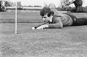 Snooker player Steve Davis on a golf course putting with a cue. 8th June 1981 Snooker player Steve Davis on a golf course putting with a cue. 8th June 1981
