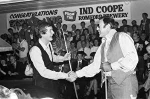 Snooker player Steve Davis with Mike Reid in Romford shaking hands after a game of Snooker player Steve Davis with Mike Reid in Romford shaking hands after a game of
