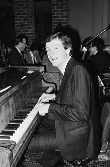 Snooker player Steve Davis playing the piano at a London reception after an announcement Snooker player Steve Davis playing the piano at a London reception after an announcement
