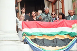 South African President Nelson Mandela addresses the crowds from the balcony of South South African President Nelson Mandela addresses the crowds from the balcony of South