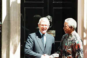 South African President Nelson Mandela is welcomed by British Prime Minister John Major South African President Nelson Mandela is welcomed by British Prime Minister John Major