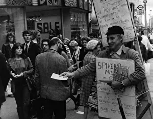 Spike Milligan actor with sandwich board handing out notices for a concert in which he Spike Milligan actor with sandwich board handing out notices for a concert in which he