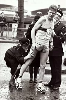 Images Dated 21st April 1985: Sport - London Marathon An athlete recieves attention from medics after receiving
