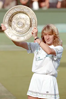 Steffi Graf pictured with her trophy, the Venus Rosewater Dish Steffi Graf pictured with her trophy, the Venus Rosewater Dish