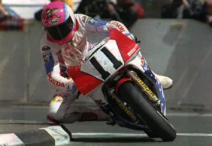 Steve Hislop Motorbike Racer and winner of the formula one goes around Quarter Bridge Steve Hislop Motorbike Racer and winner of the formula one goes around Quarter Bridge