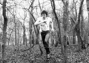 Steve Jones pop guitarist The Sex Pistols, running through woods in Holland Steve Jones pop guitarist The Sex Pistols, running through woods in Holland