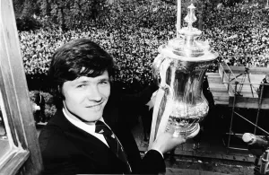 Steve Perryman with the FA cup and thousands of Tottenhan Hotspur fans behind him Steve Perryman with the FA cup and thousands of Tottenhan Hotspur fans behind him