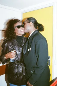 Stevie Wonder kisses Whitney Houston on the cheek as they laugh backstage at the Nelson Stevie Wonder kisses Whitney Houston on the cheek as they laugh backstage at the Nelson