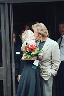 Sting holds and his bride Trudie Styler outside Camden register office, London Sting holds and his bride Trudie Styler outside Camden register office, London