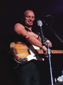 Sting rock singer on stage in Aberdeen commenting on how cold it is rubbing his arm with Sting rock singer on stage in Aberdeen commenting on how cold it is rubbing his arm with