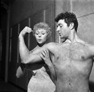 Strong man of Television Arthur Mason showing of his muscles to girlfriend Vera Day Strong man of Television Arthur Mason showing of his muscles to girlfriend Vera Day