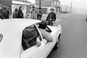Strongman Reg Morris pulls car and passengers with his teeth. February 1975 75-00777-005 Strongman Reg Morris pulls car and passengers with his teeth. February 1975 75-00777-005