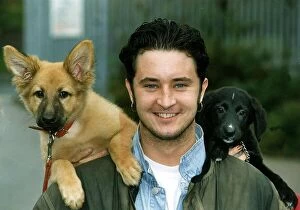 Images Dated 26th October 1990: Stuart Wolfenden Actor with the two dogs he rescued from oldham RSPCA Named Tango