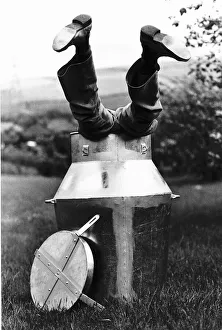 Stunts escapologist David De Val practises in a 12 gallon container filled with beer d Stunts escapologist David De Val practises in a 12 gallon container filled with beer d