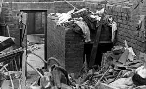 A surface air raid shelter in a backyard which was undamaged when a bomb wrecked a house A surface air raid shelter in a backyard which was undamaged when a bomb wrecked a house