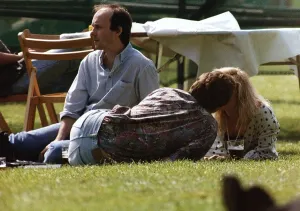 Suzanne Dando TV Presenter with boyfriend Christopher Qakes laying on grass kissing Suzanne Dando TV Presenter with boyfriend Christopher Qakes laying on grass kissing