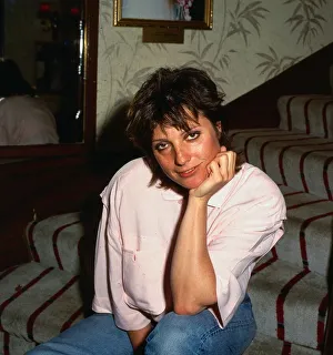 Suzanne Danielle August 1987 actress sitting on stairs hand at chin Suzanne Danielle August 1987 actress sitting on stairs hand at chin