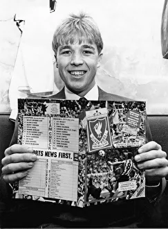 Swansea City footballer Andy Legg holding a football programme ahead of his side' Swansea City footballer Andy Legg holding a football programme ahead of his side'