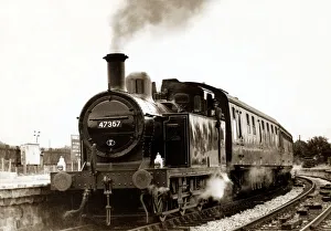 A tank engine arriving at a rural English train station on a preservation line circa 1990 A tank engine arriving at a rural English train station on a preservation line circa 1990