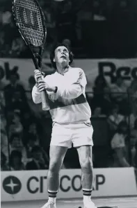 Television presenter and chat show host Terry Wogan playing tennis with a giant racket Television presenter and chat show host Terry Wogan playing tennis with a giant racket