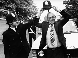 Telly Savalas Greek actor tries on police helmet, June 1980 Telly Savalas Greek actor tries on police helmet, June 1980