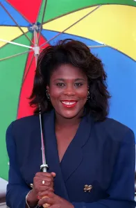 TESSA SANDERSON, ATHLETE - HOLDING MULTI-COLOURED UMBRELLA 15/07/1992 TESSA SANDERSON, ATHLETE - HOLDING MULTI-COLOURED UMBRELLA 15/07/1992