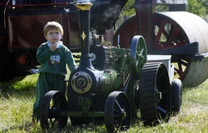 Three-year-old Richard Baillie from Forest hall with a miniature traction engine on 13th Three-year-old Richard Baillie from Forest hall with a miniature traction engine on 13th