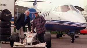 Tom Hunter with Jackie Stewart March 1999 with a race car with the new Lear Jet Tom Hunter with Jackie Stewart March 1999 with a race car with the new Lear Jet