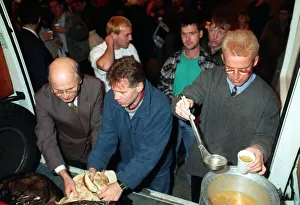 TOMMY BURNS CELTIC MANAGER AND FERGUS McCANN WHO ASSISTED THE CHARITY WORKERS IN FEEDING TOMMY BURNS CELTIC MANAGER AND FERGUS McCANN WHO ASSISTED THE CHARITY WORKERS IN FEEDING