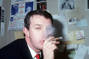 Tommy Gilmour smoking cigar in office February 1989 Tommy Gilmour smoking cigar in office February 1989