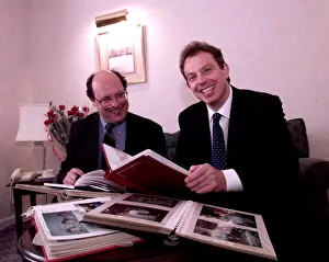 Tony Blair looking through family photograph albums Tony Blair looking through family photograph albums