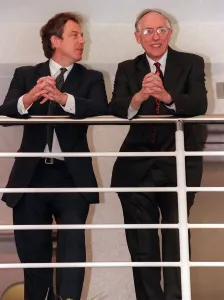 Tony Blair looks sideways at Donald Dewar April 1999 leaning on railings at the new Tony Blair looks sideways at Donald Dewar April 1999 leaning on railings at the new