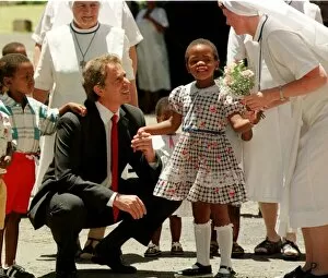 Images Dated 8th January 1999: Tony Blair South Africa Visit January 1999 with the Aids child he sponsors at