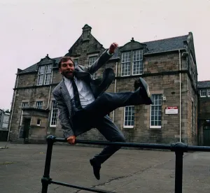 Bill Torrance - Singer TV Presenter jumping over fence at Broxburn Primary Bill Torrance - Singer TV Presenter jumping over fence at Broxburn Primary