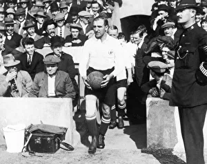 Tottenham Hotspur captain Arthur Grimsdell leads out his team for a match, circa 1920 Tottenham Hotspur captain Arthur Grimsdell leads out his team for a match, circa 1920