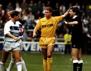 Tottenham Hotspur footballer Paul Gascoigne pats the referee on the head during a match Tottenham Hotspur footballer Paul Gascoigne pats the referee on the head during a match