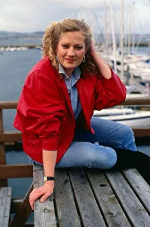 Tracey Childs sitting on wooden table November 1988 Tracey Childs sitting on wooden table November 1988