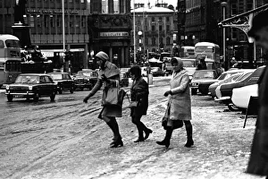 Traffic and pedestrains struggle against the snow on Neville Street Traffic and pedestrains struggle against the snow on Neville Street