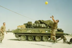 US troops play volley ball to pass the time during the build up of force before the start US troops play volley ball to pass the time during the build up of force before the start
