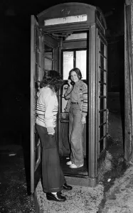 Twelve-year-old Martine Coles makes a call from the phone box in Pontypridd that is going Twelve-year-old Martine Coles makes a call from the phone box in Pontypridd that is going