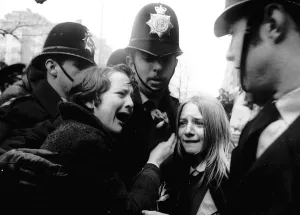 Upset Beatles fans crying because Paul McCartney got married are led away by police Upset Beatles fans crying because Paul McCartney got married are led away by police