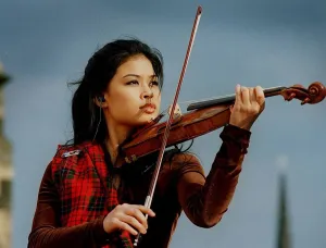 Vanessa Mae at Edinburgh Castle playing violin wearing tartan 1996 Vanessa Mae at Edinburgh Castle playing violin wearing tartan 1996