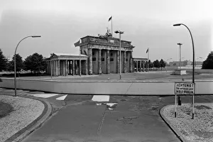 View of the Berlin Wall near the Brandenburg gate. The Berlin Wall was a barrier View of the Berlin Wall near the Brandenburg gate. The Berlin Wall was a barrier