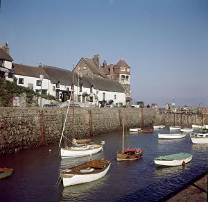 View of the town of Lynmouth on the North Devon coast, showing boats moored in View of the town of Lynmouth on the North Devon coast, showing boats moored in