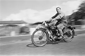 A vintage motorbike enthusiast out for a Sunday ride on his 1928 AJS Motorcycle at A vintage motorbike enthusiast out for a Sunday ride on his 1928 AJS Motorcycle at