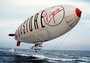 Virgin Airship - A man water ski's behind an airship flying low over the sea Virgin Airship - A man water ski's behind an airship flying low over the sea